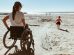 Woman and Child On Wheelchair Accessible Beach